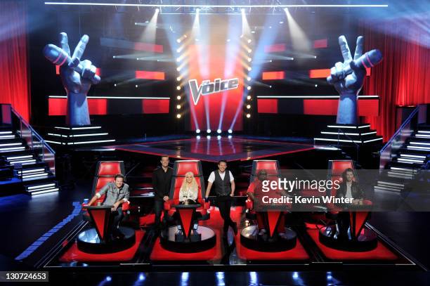 Singer Blake Shelton, host Carson Daly, singer Christina Aguilera, executive producer Mark Burnett, singers Cee Lo Green and Adam Levine appear at a...