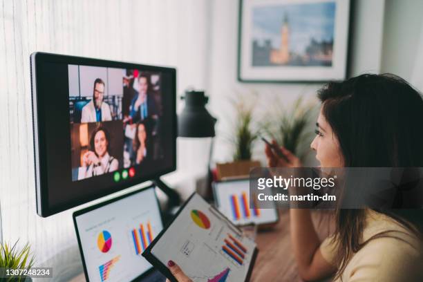 business meeting on video call during covid-19 - telecommuting stock pictures, royalty-free photos & images