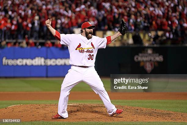 Jason Motte of the St. Louis Cardinals celebrates after defeating the Texas Rangers 6-2 to win the World Series in Game Seven of the MLB World Series...