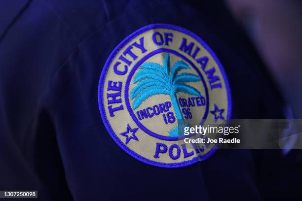 Patch is seen on the shoulder of a police officer as the City of Miami's new Police Chief Art Acevedo speaks to the media during his introduction at...