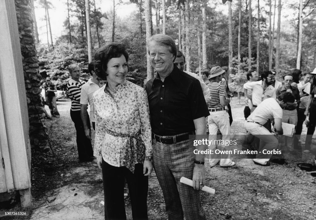 Jimmy Carter with his wife, Rosalynn, after a talk with the press in the woods near his home in Plains, Georgia