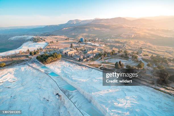 aerial view of hot air balloons over travertine pools and hierapolis in pamukkale at sunrise ,denizli - pamukkale stock pictures, royalty-free photos & images