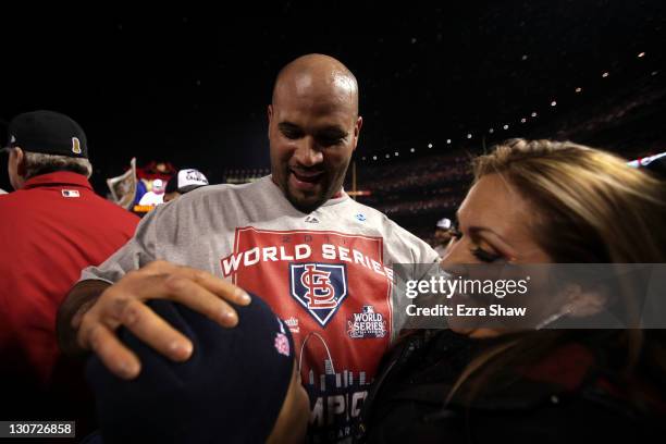 Albert Pujols of the St. Louis Cardinals celebrates with family after defeating the Texas Rangers 6-2 to win Game Seven of the MLB World Series at...