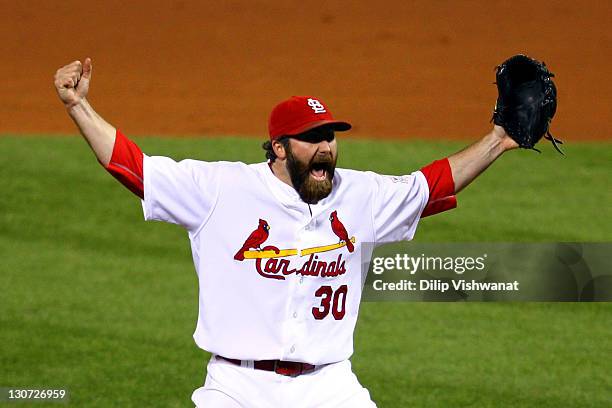 Jason Motte of the St. Louis Cardinals celebrates after defeating the Texas Rangers 6-2 to win the World Series in Game Seven of the MLB World Series...