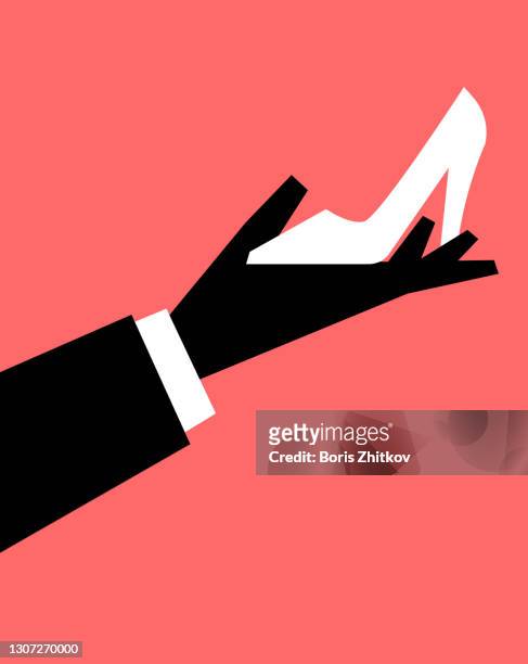 male hand holding white high heel shoe. - man in high heels stock pictures, royalty-free photos & images