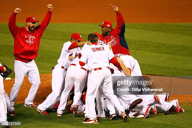 Chris Carpenter and Arthur Rhodes of the St. Louis Cardinals celebrate after defeating the Texas Rangers 6-2 to win the World Series in Game Seven of...
