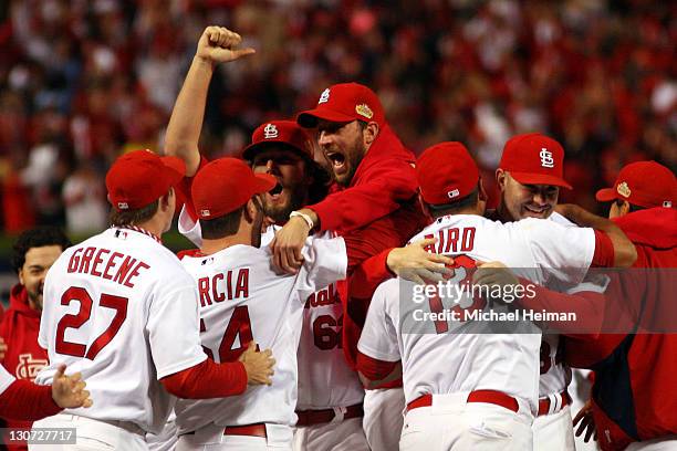 Adam Wainwright, Jaime Garcia and Gerald Laird he St. Louis Cardinals celebrate after defeating the Texas Rangers 6-2 to win the World Series in Game...