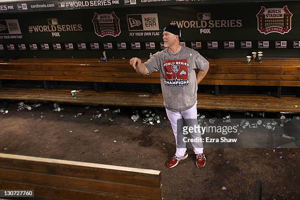 Coach Mark McGuire of the St. Louis Cardinals celebrates after defeating the Texas Rangers 6-2 to win Game Seven of the MLB World Series at Busch...