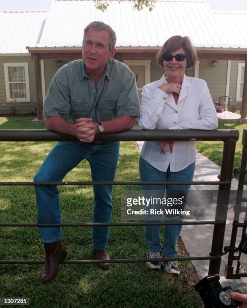 Republican presidential candidate George W. Bush and his wife Laura speak to the press July 21, 2000 at their ranch in Crawford, Texas.