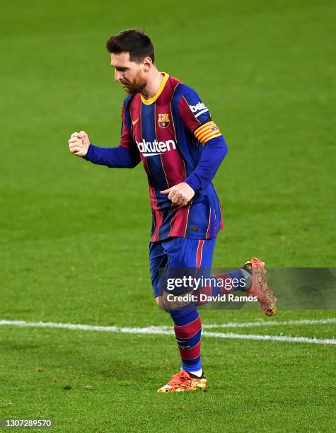 Lionel Messi of FC Barcelona celebrates after scoring their side's fourth goal during the La Liga Santander match between FC Barcelona and SD Huesca...