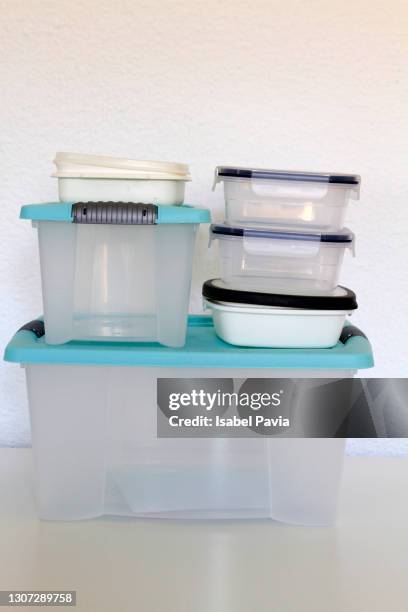 stack of recyclable plastic food containers - industrial storage bins stockfoto's en -beelden