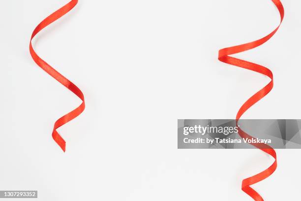 white background with red ribbons - ribbon foto e immagini stock