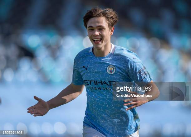 Callum Doyle of Manchester City celebrates after scoring their team's second goal during the Premier League 2 match between Manchester City U23 and...