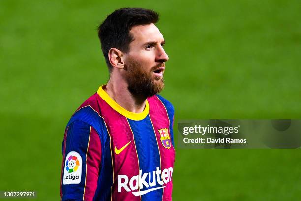 Lionel Messi of FC Barcelona looks on during the La Liga Santander match between FC Barcelona and SD Huesca at Camp Nou on March 15, 2021 in...