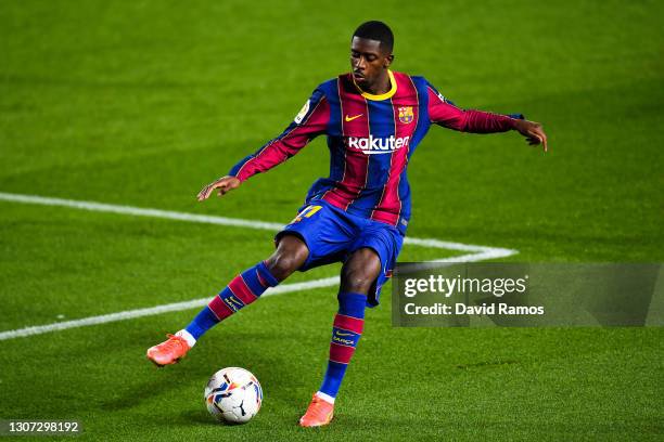 Ousmane Dembele of FC Barcelona runs with the ball during the La Liga Santander match between FC Barcelona and SD Huesca at Camp Nou on March 15,...