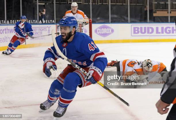 Colin Blackwell of the New York Rangers scores a second period goal against Carter Hart of the Philadelphia Flyers at Madison Square Garden on March...