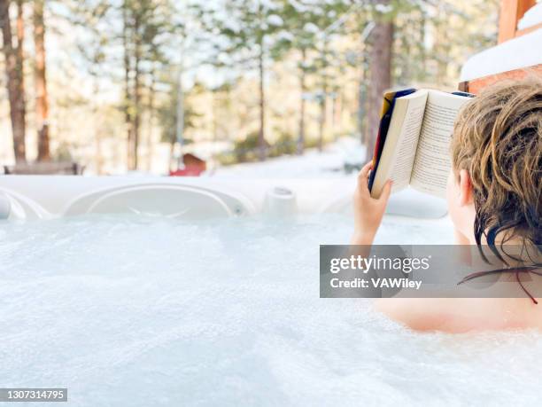 distant learning while in a hot tub at home - whirlpool stock pictures, royalty-free photos & images