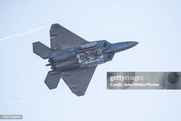 raptor f-22 fighter jet flying over avalon airport. australia. - f 22 raptor stock pictures, royalty-free photos & images