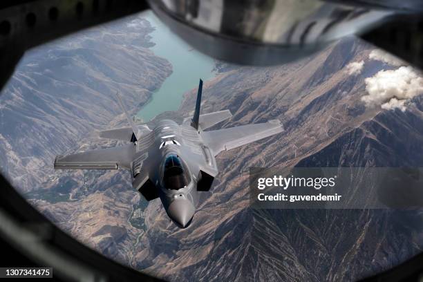 f-35 jet fighter mid-air refueling - f 35 fighter stock pictures, royalty-free photos & images