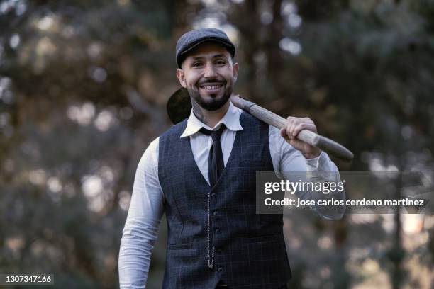 gangster mafia man with classic clothes and shovel burying - dead gangster stock pictures, royalty-free photos & images