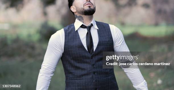 gangster mafia man with classic clothes pocket watch in nature - dead gangster stock pictures, royalty-free photos & images