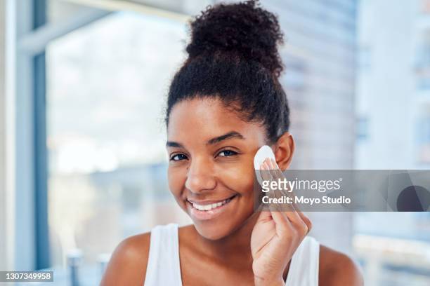 i keep my skin clean and moisturised - cotton pad stock pictures, royalty-free photos & images
