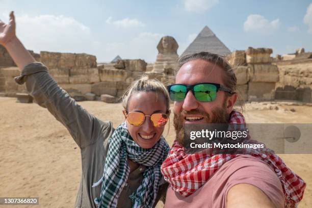 happy couple take selfie at the pyramids, egypt - pyramid stock pictures, royalty-free photos & images