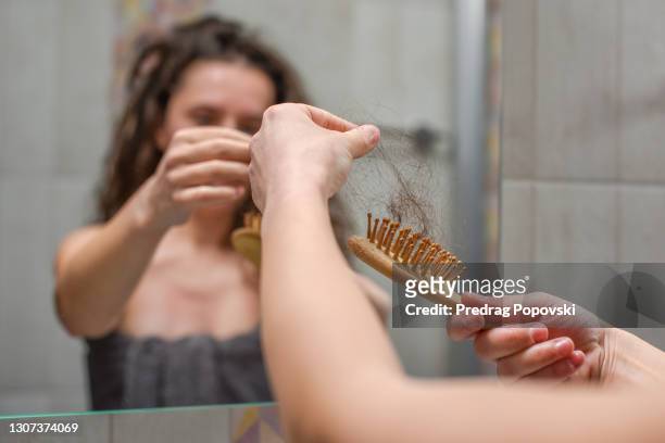 hair loss - eisenmangel stock-fotos und bilder