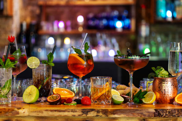  assortment of alcoholic cocktails on a bar counter - nightclub food stock pictures, royalty-free photos & images