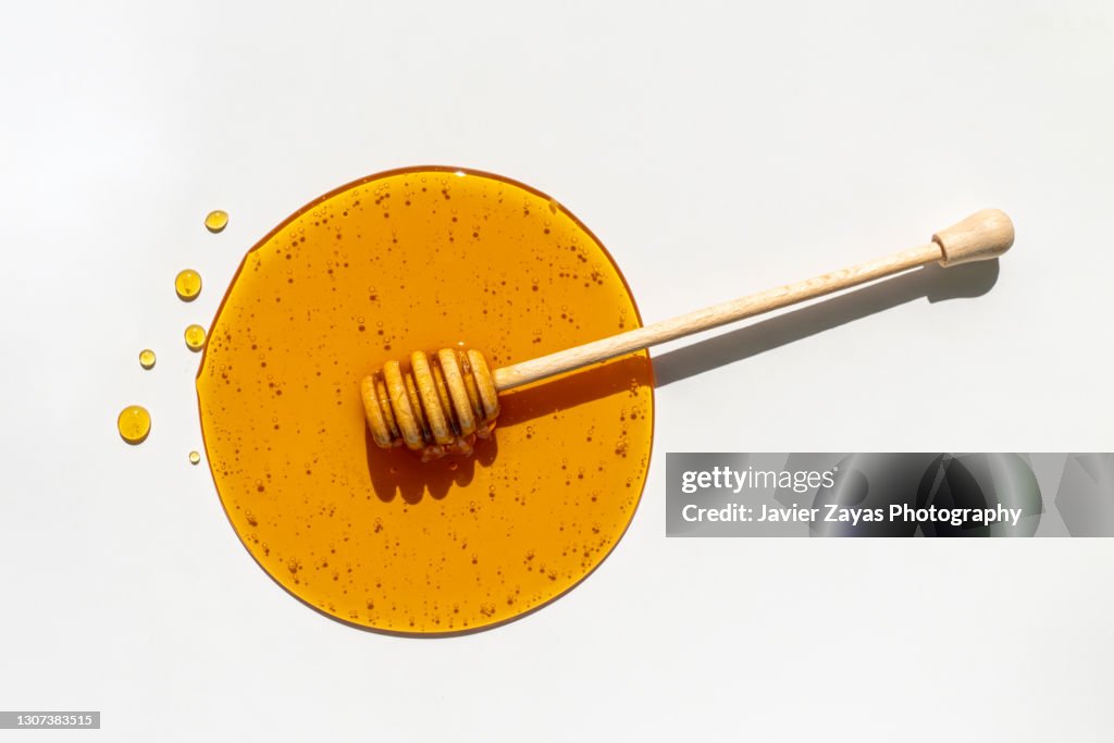 Honey Dripper On Honey Background