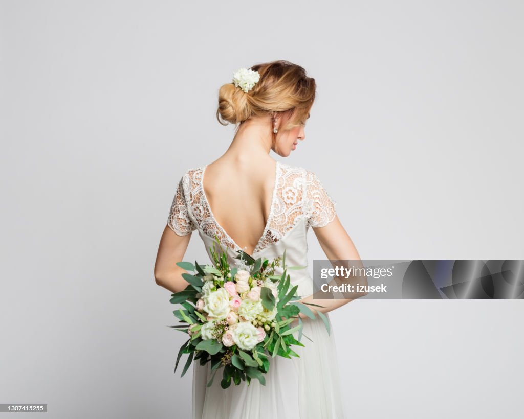 Back view of bride with flowers