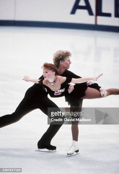 Jenni Meno and Scott Wendland of the USA compete in the Pairs Free Skate event in the Figure Skating competition of the 1992 Winter Olympic Games on...