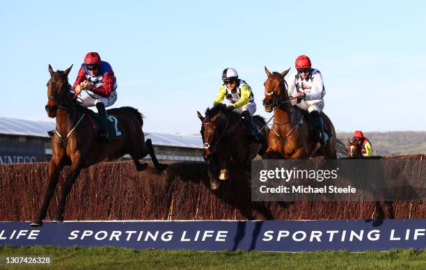 Galvin ridden by Jack Kennedy jumps the last to beat Next Destination ridden by Harry Cobden and Escaria Ten ridden by Adrian Heskin in the Sam...