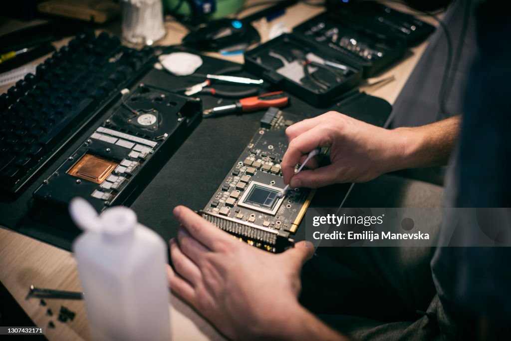 Engineer fixing computer