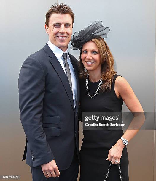 Matthew Lloyd and his wife Lisa Lloyd attend Victoria Derby Day at Flemington Racecourse on October 29, 2011 in Melbourne, Australia.