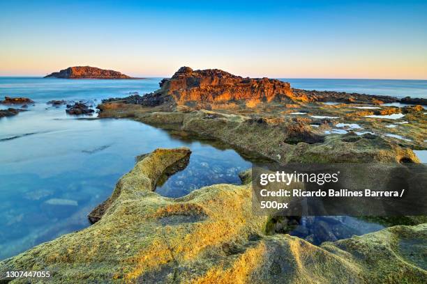 scenic view of sea against clear sky during sunset,roque de arinaga,las palmas,spain - grand canary stock pictures, royalty-free photos & images