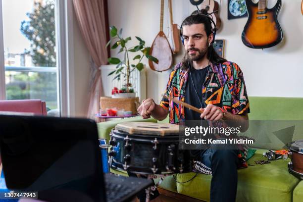 young drummer having video concert during lockdown - cymbal stock pictures, royalty-free photos & images