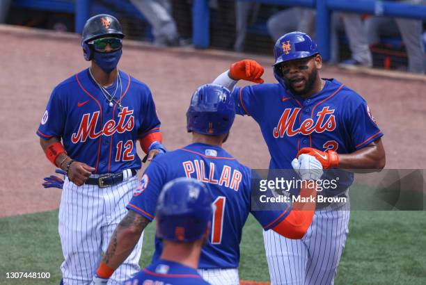 Dominic Smith of the New York Mets celebrates with Francisco Lindor, and Kevin Pillar of the New York Mets after hitting a three run home run in the...