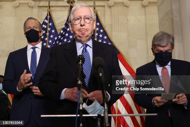 Senate Minority Leader Mitch McConnell talks to reporters with Sen. John Thune and Sen. Roy Blunt following the weekly Senate Republican caucus...