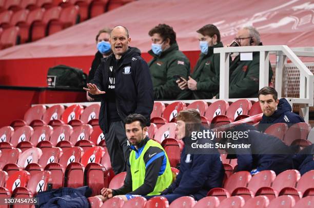 Alex Neil , Manager of Preston North End reacts as he is seen in the stand after being shown a red card during the Sky Bet Championship match between...