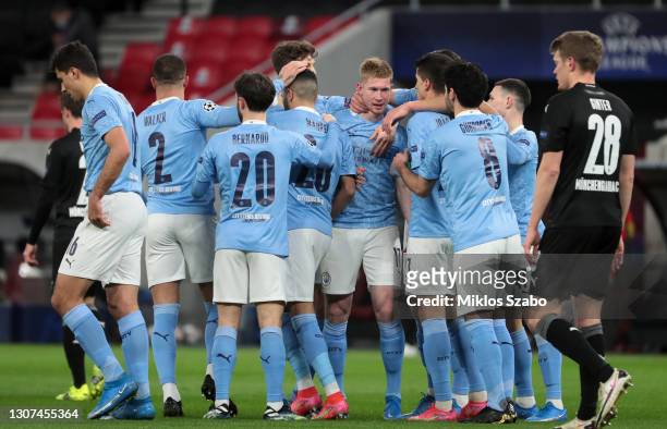 Kevin De Bruyne of Manchester City celebrates with team mates after scoring their side's first goal during the UEFA Champions League Round of 16...
