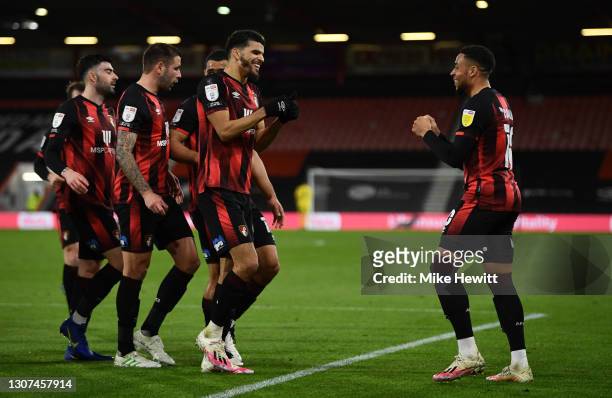 Dominic Solanke of AFC Bournemouth celebrates with Arnaut Danjuma and team mates after scoring their side's second goal during the Sky Bet...
