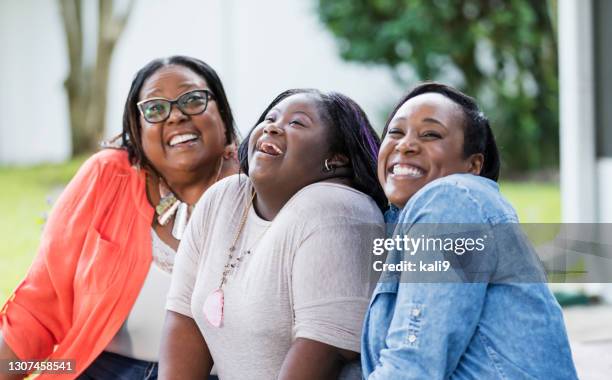 three generation family, teenage girl with down syndrome - chubby granny stock pictures, royalty-free photos & images