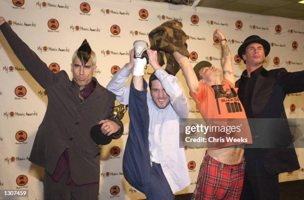 The musical group "Red Hot Chili Peppers," winners of awards for "Must-Have Album" and "Pushing the Envelope Video," pose for photographers at the...