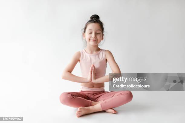 cute girl doing yoga - physical description stock pictures, royalty-free photos & images