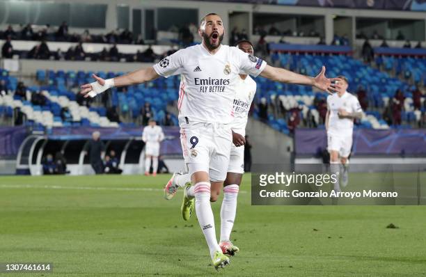 Karim Benzema of Real Madrid celebrates after scoring their side's first goal during the UEFA Champions League Round of 16 match between Real Madrid...
