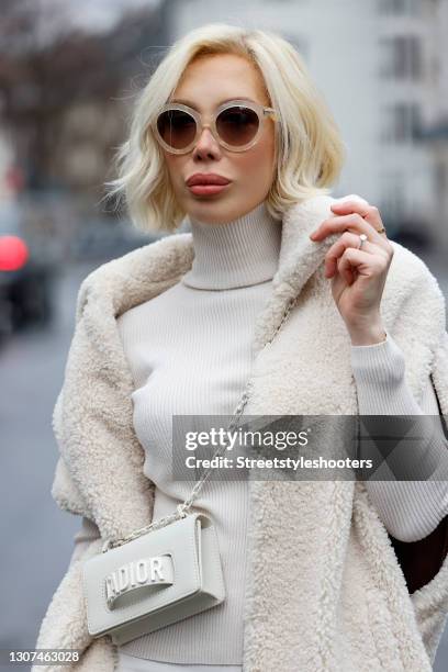 Hair stylist Svenja Simmons wearing a cream colored long teddy vest by Marsh, a cream colored turtleneck pullover by Rene Lezard, a cream colored bag...