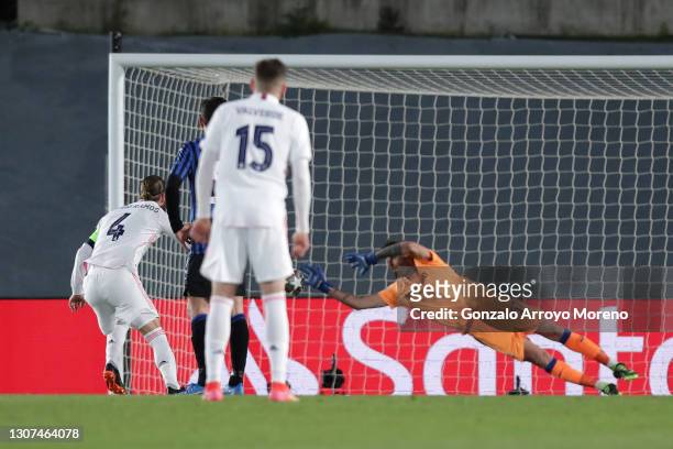 Sergio Ramos of Real Madrid scores their side's second goal from the penalty spot passed Marco Sportiello of Atalanta B.C during the UEFA Champions...