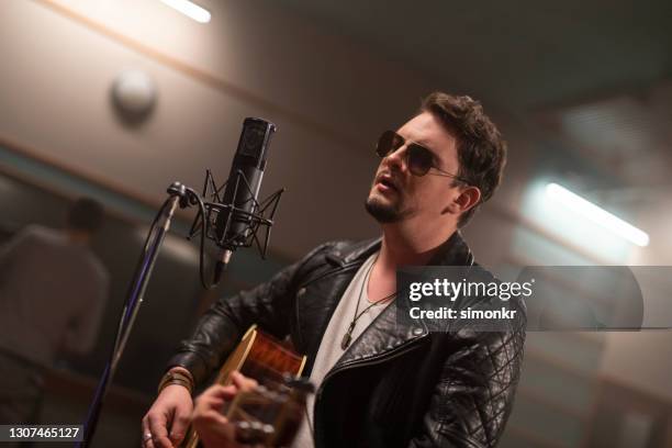 Singer Playing Instrument 544 Top Specialty Instrument Player Stock Photos, High-Res Pictures ...