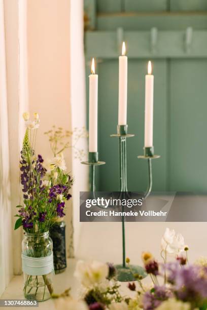 candle holder with three candles - candlestick holder stock pictures, royalty-free photos & images